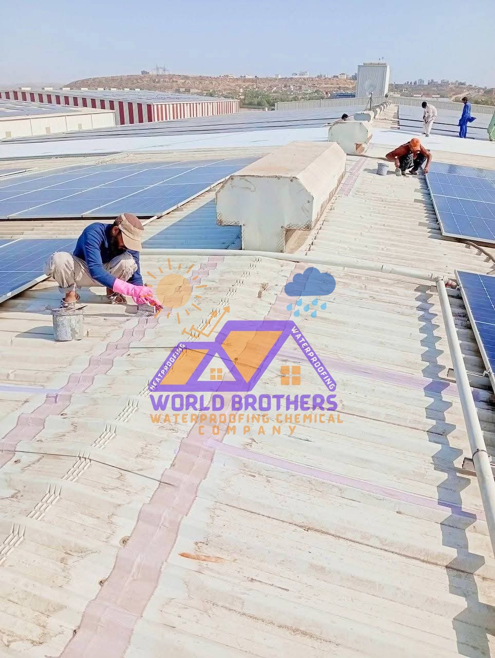 Team sealing an industrial G.I. sheet roof between solar panel rows