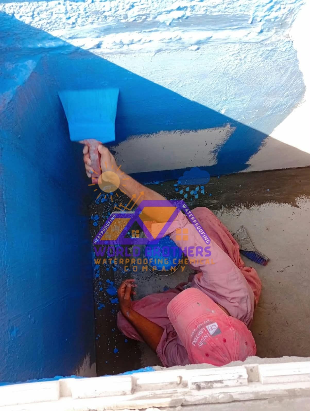 Water tank corners being repaired and chemically sealed against leakage